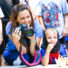 Staff member with camera sitting watching campers