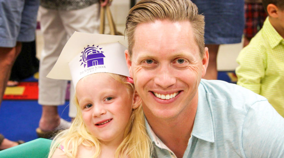 Camp director Joe smiling next to Dagny