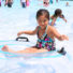 Girl sitting in an inner-tube in the pool