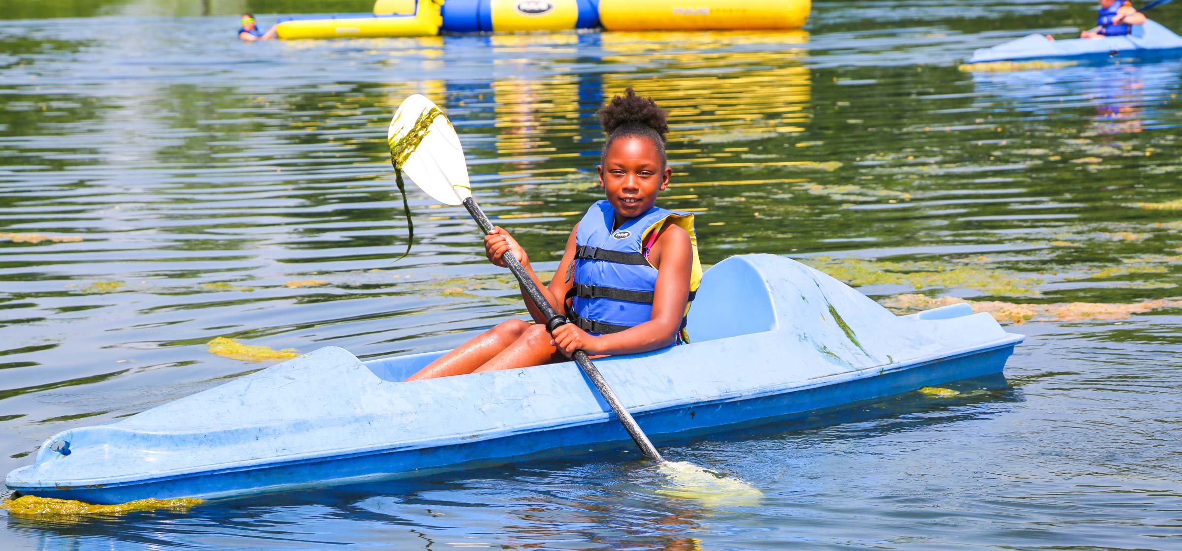 Camper kayaking in the lake