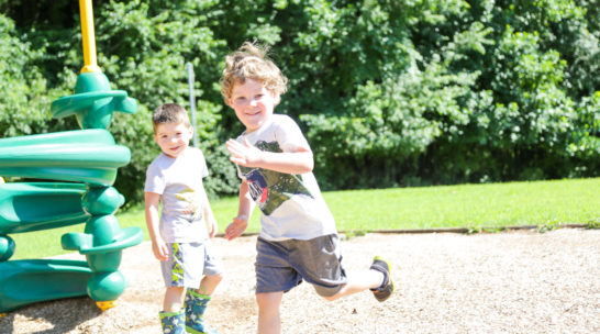 Camper running on the playground