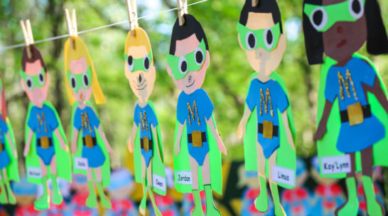 String of paper dolls with campers names on them