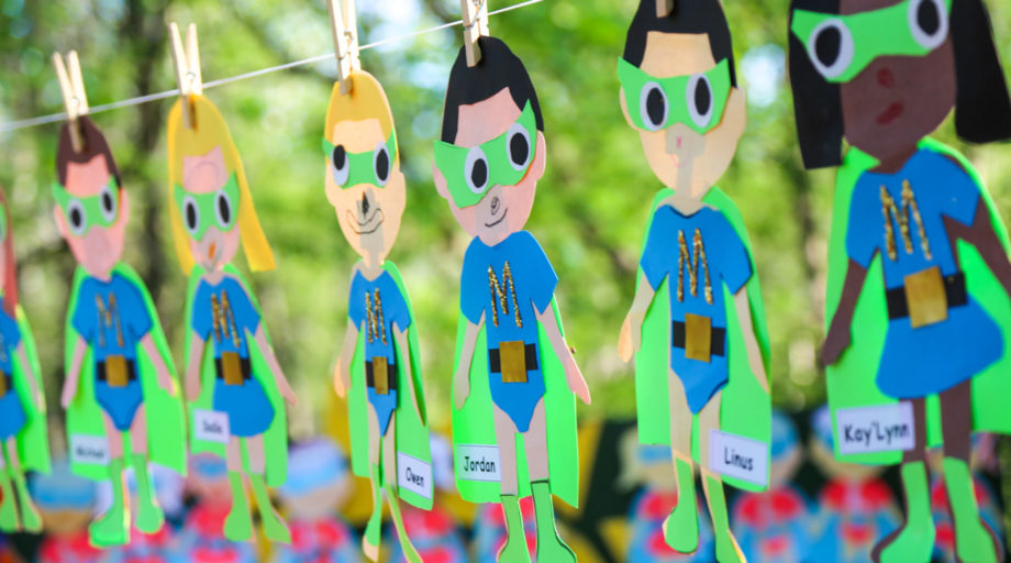 String of paper dolls with campers names on them