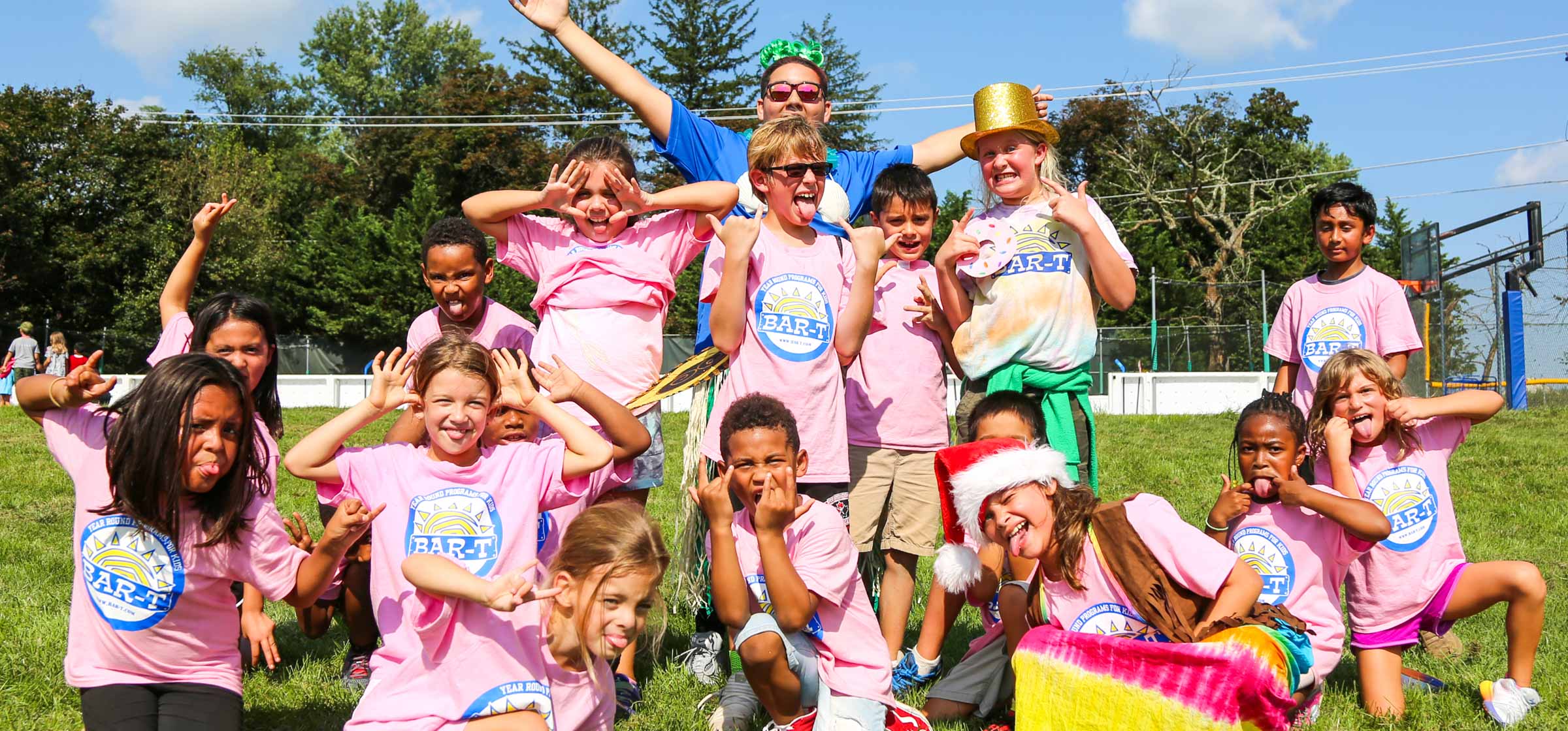 Group of campers in pink making silly faces