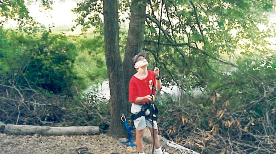 Joe learns how to belay as a teen on the ropes course at Waredaca