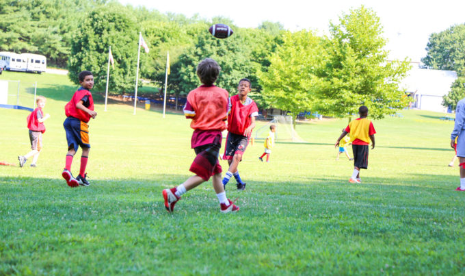 Boys playing a football game